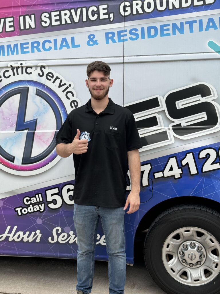 Certified electrician David from Ochoa Electric Services beside a service van, providing expert Commercial Electrical Contractor El Paso services for local businesses and commercial properties.
